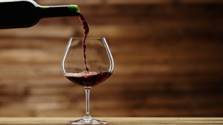 bigstock-Pouring-red-wine-into-the-glas-64905025-voi