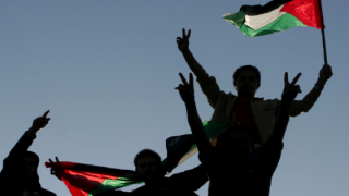 Caption: Palestinian youths at a rally calling for a reconciliation between Hamas in Gaza and Fatah in the West Bank, 2011. Photo: Mohammed Othman/Flash90