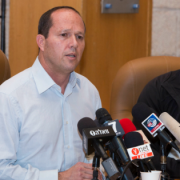 Jerusalem Mayor Nir Barkat and his security guard at a press conference, following his subduing of a Palestinian terrorist in the city. Photo: Yonatan Sindel/Flash90