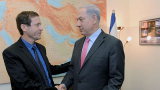 Caption: Labor leader Isaac Herzog (left) and Prime Minister Benjamin Netanyahu. Will they debate in English? Photo: Koby Gideon/GPO