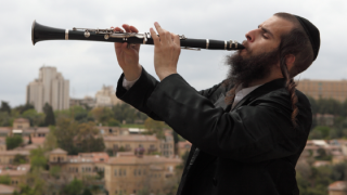 Caption: Playing klezmer music in Jerusalem, 2012. Photo: Yaakov Naumi/Flash90