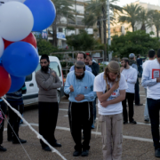 Right wing supporters seen praying before this evening's rally in support of current Prime Minister Benjamin Netanyahu, at Rabin Square in Tel Aviv on March 15, 2015, ahead of the Knesset elections taking place on March 17. Photo by Ben Kelmer/Flash90