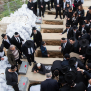 Mourners attend the funeral of the seven children from the Sassoon family in Jerusalem on March 23, 2015. The seven children died early on Saturday after flames ripped through their Brooklyn home. the children who died, Yaakob Sassoon, 5, Sara, 6, Moshe, 8, Yeshua, 10, Rivkah, 11, David, 12, and Eliane, 16. Photo: Yonatan Sindel/Flash90