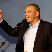Moshe Kahlon, leader of the Kulanu party, speaks to supporters as the exit polls from the Knesset elections were released. Photo: Flash90