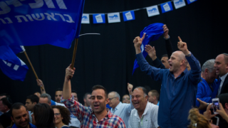 Likud supporters celebrate at the party headquarters in Tel Aviv following the release of the exit polls from the elections for the 20th Knesset. Photo by Miriam Alster/Flash90