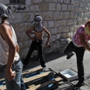 Palestinian youth hurling rocks at Israeli security forces. Photo: Nati Shohat/FLASH90