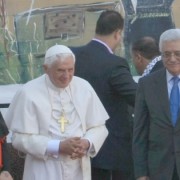 From left in foreground, Vatican Secretary of State Tarcisio Bertone, Pope Benedict XVI, and Palestinian President Mahmoud Abbas at the Aida Refugee camp in Bethlehem, Wednesday, May 13, 2009. In background, a part of a separation barrier. Photo: Kobi Gideon/FLASH90