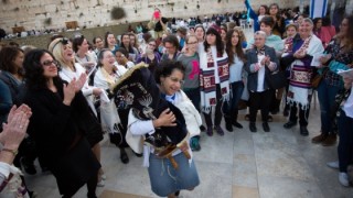Women of the Wall praying with a Torah scroll. Photo: Miriam Alster/FLASH90